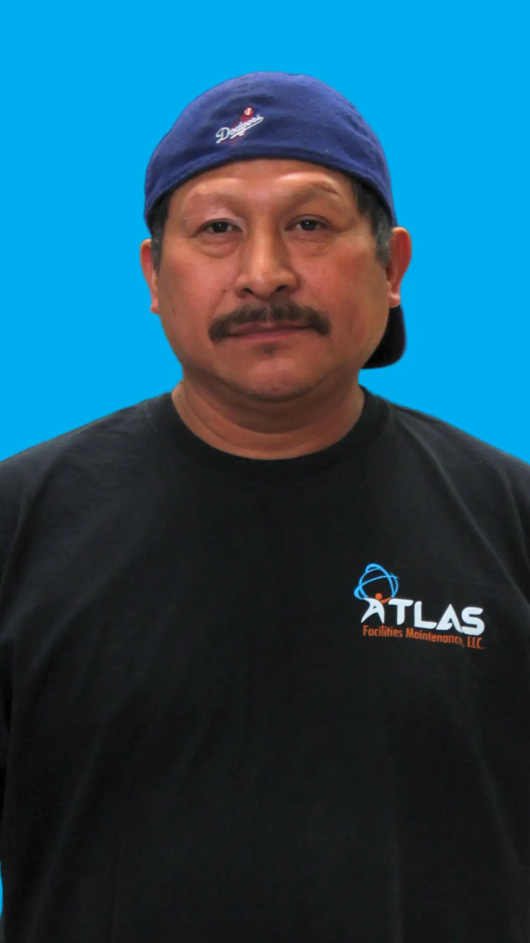 Commercial Cleaner wearing the new Atlas Facilities Maintenance Uniform