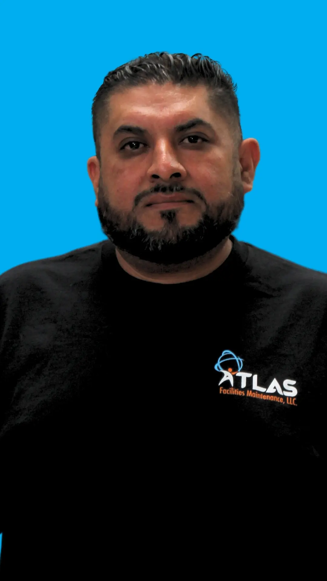 Commercial Cleaner wearing the new Atlas Facilities Maintenance Uniform