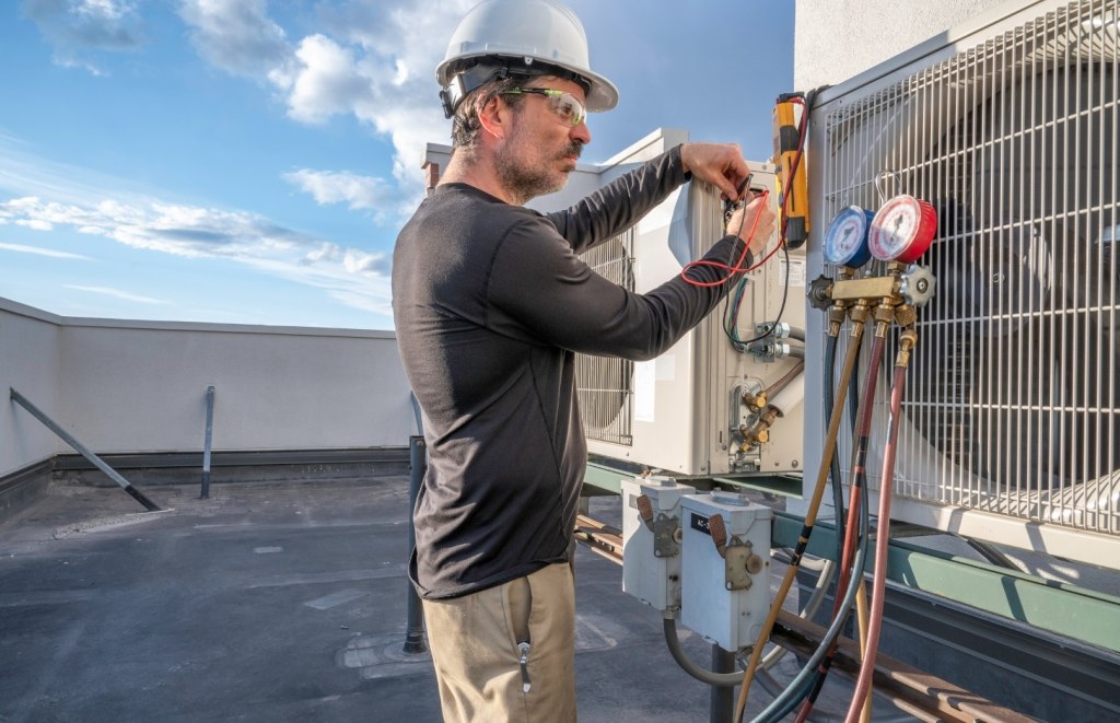 handyman fixing HVAC