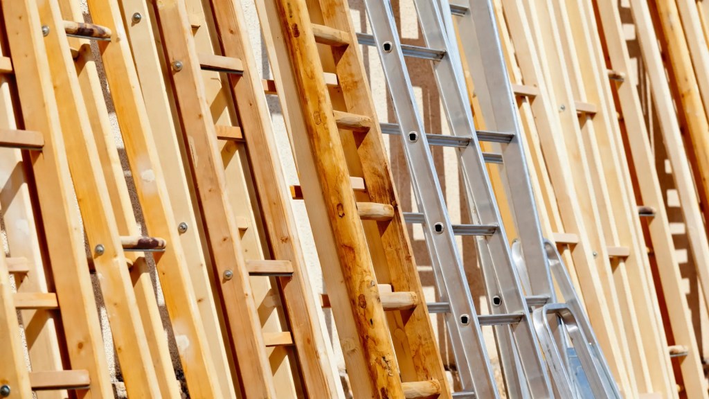 steel and wooden laders leaning against wall