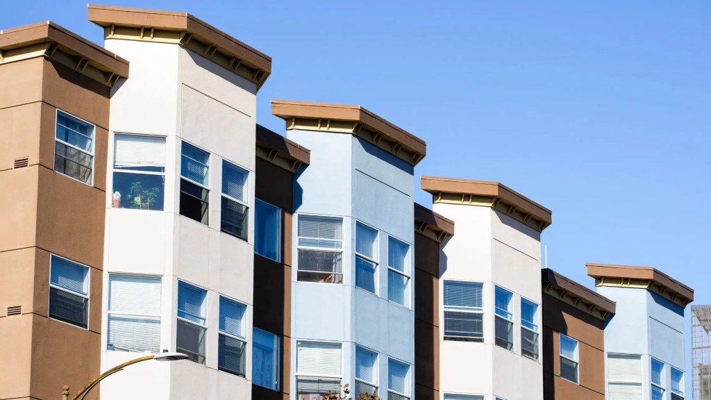 row of  uniform multifamily housing properties