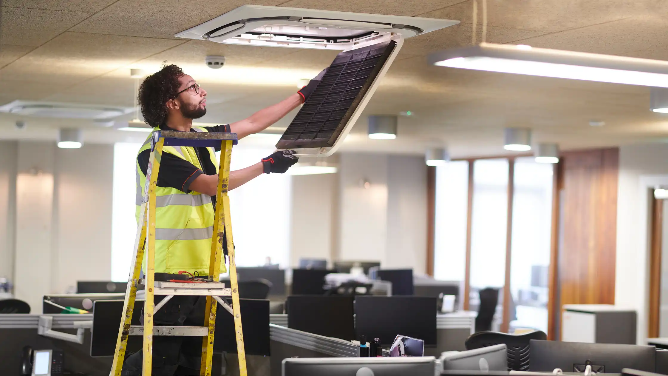 a man checking the ceiling